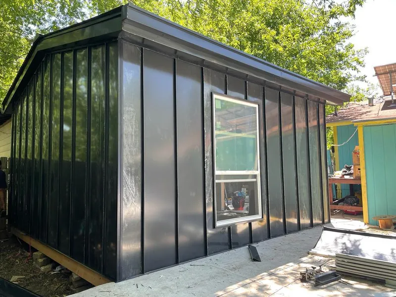 Black standing seam metal wall panels for Roof Inspection in Southold