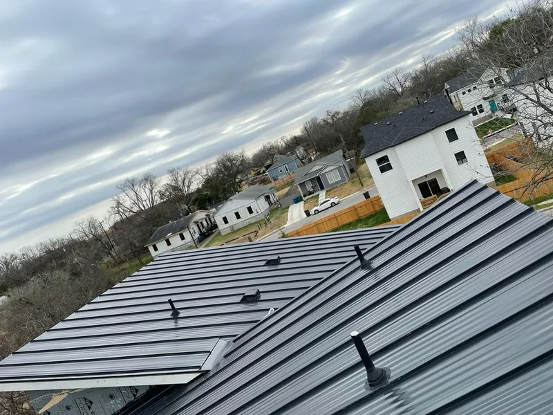 Standing seam metal roof panels with vents for Skylight Repair in Southold